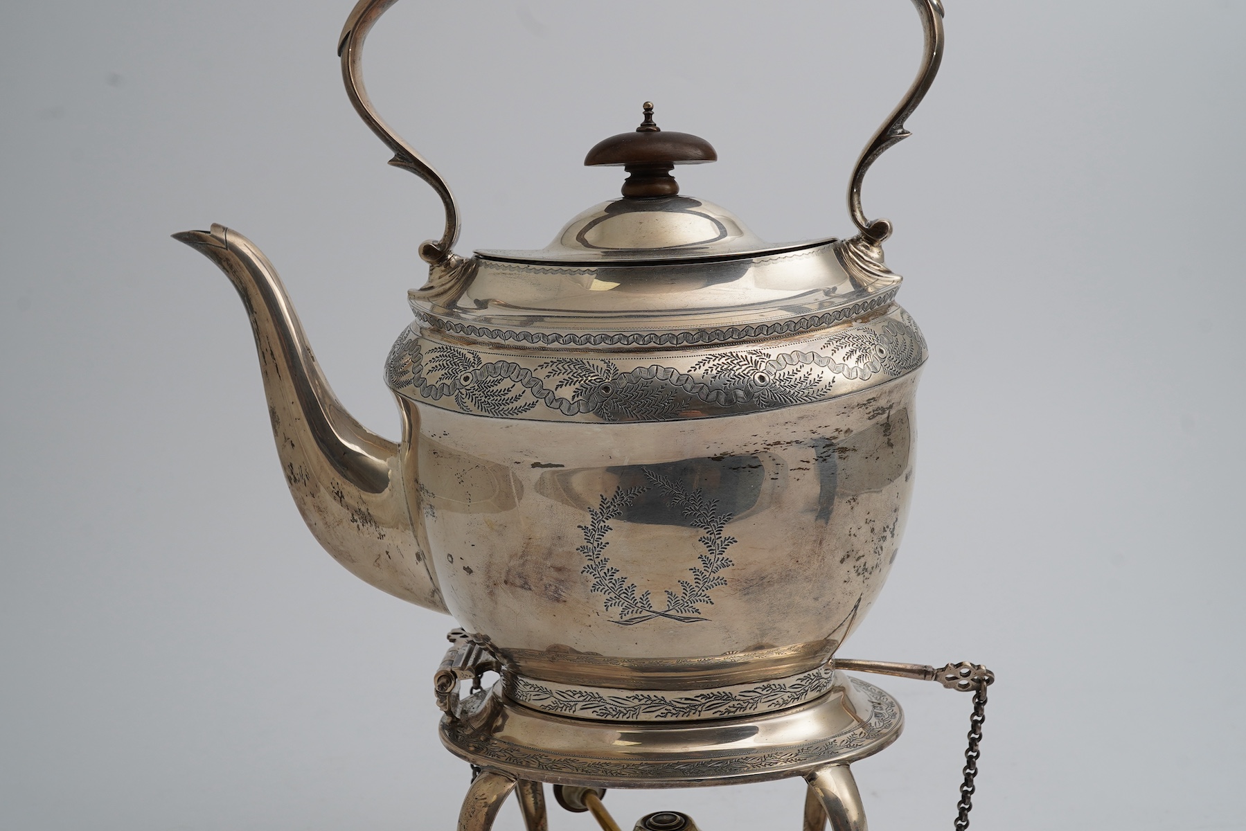 A George V silver oval tea kettle on stand with plated burner, Crichton Brothers